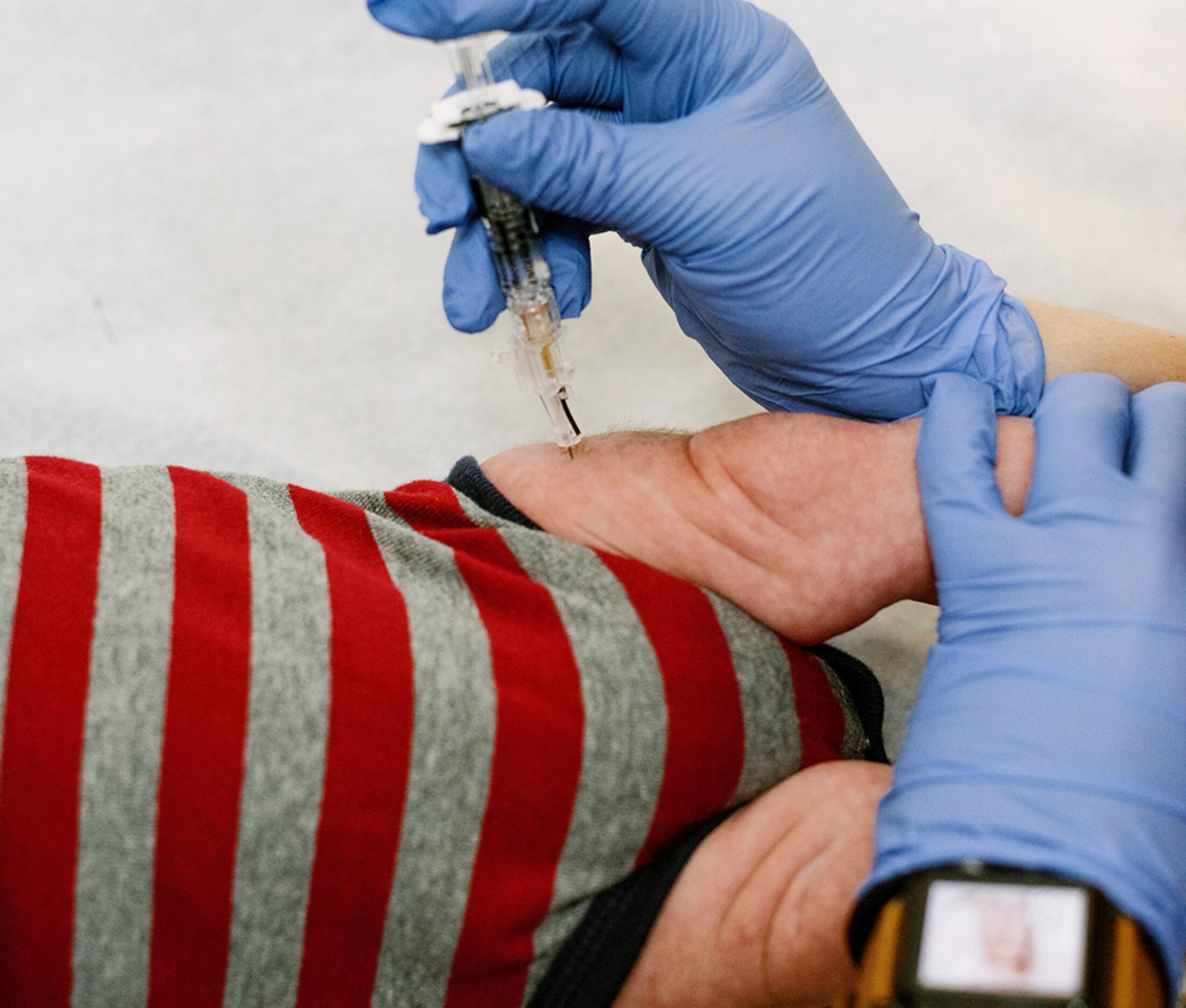 Baby getting a vaccine shot in the leg