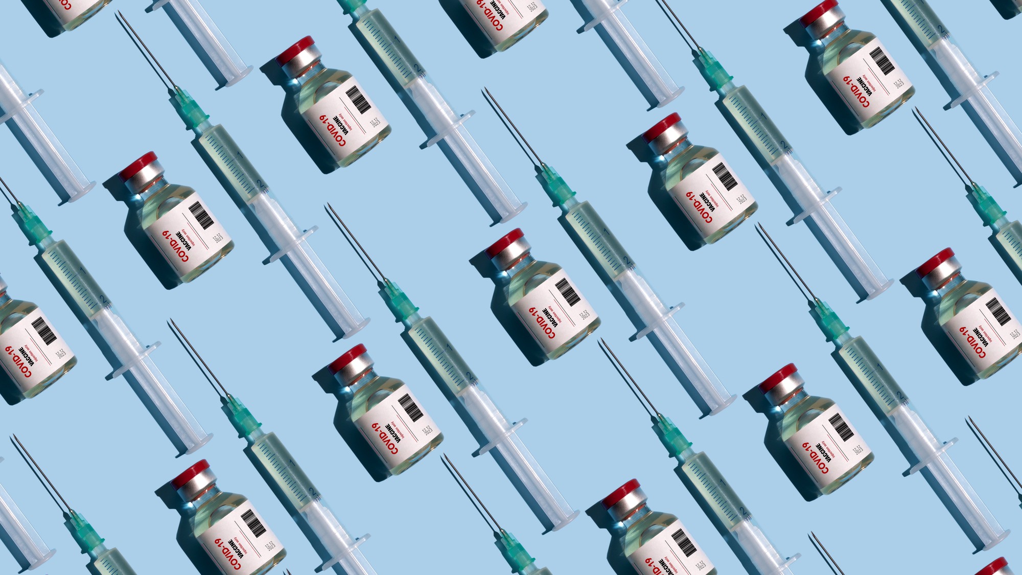 Covid-19 vaccines and vials on blue background