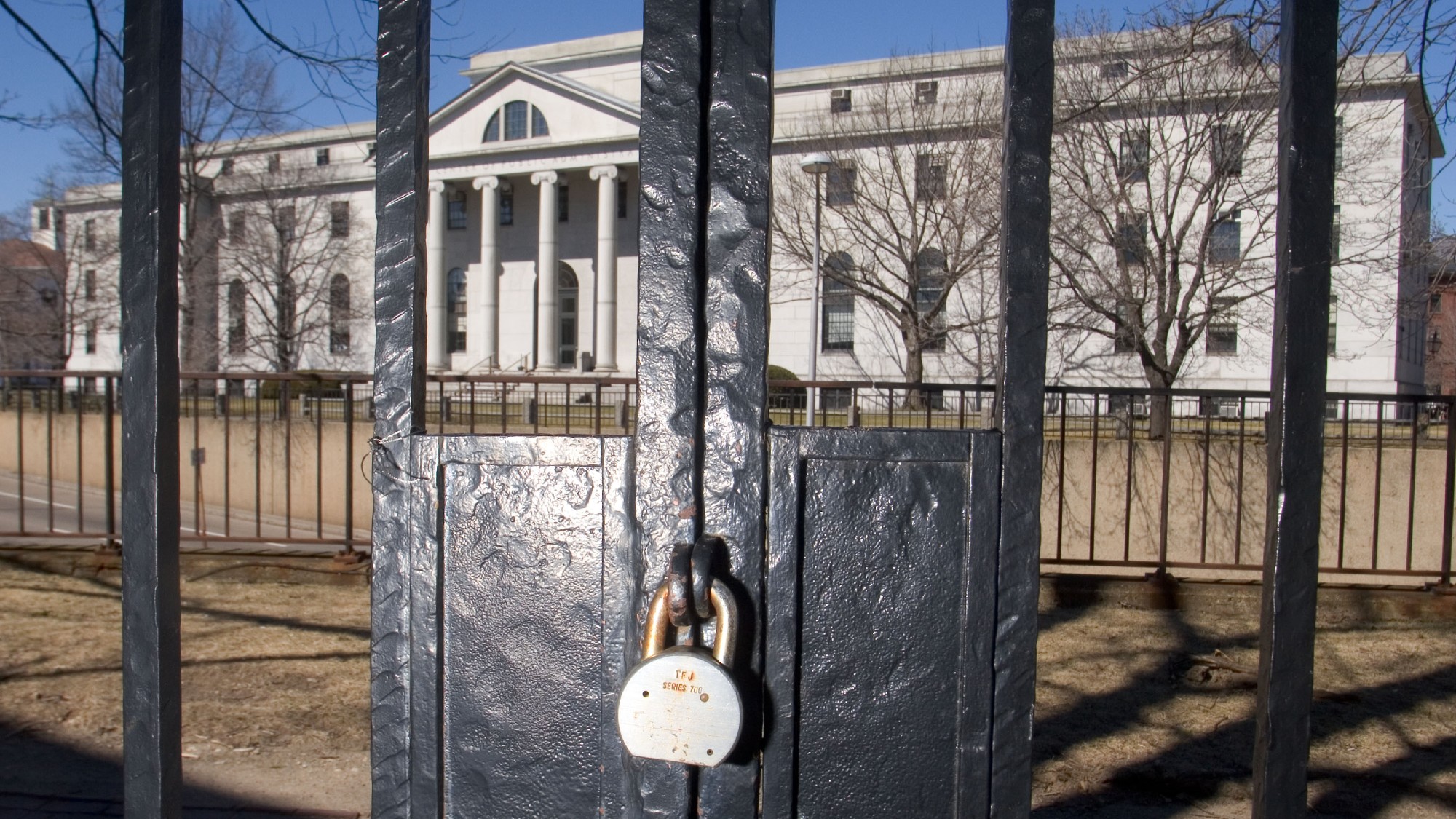 A padlock on a gate on the Harvard campus 