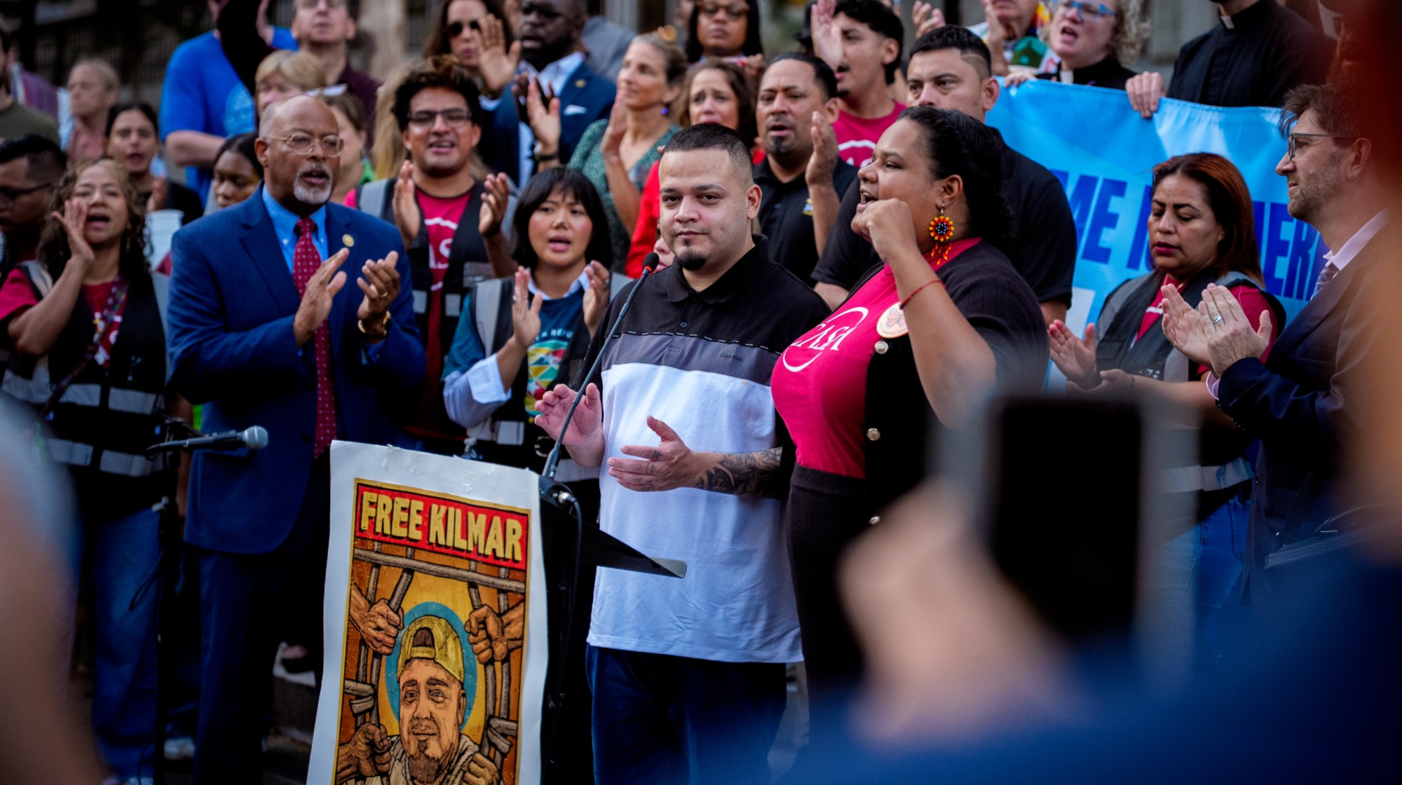 BALTIMORE, MARYLAND - AUGUST 25: Kilmar Abrego Garcia (C), accompanied by Rep. Glenn Ivey (D-MD) (L), prepares to speak at an immigration rally before entering a U.S. Immigration and Customs Enforcement (ICE) field office on August 25, 2025 in Baltimore, Maryland. Three days after being released, Garcia has been detained again, as the U.S. Government is threatening to deport Garcia, a Maryland construction worker from El Salvador, to Uganda after he rejected a plea deal to be charged with Human Smuggling and deported to Costa Rica. Earlier this year Garcia was wrongfully deported to the notorious anti-terrorism prison CECOT in El Salvador. (Photo by Andrew Harnik/Getty Images)
