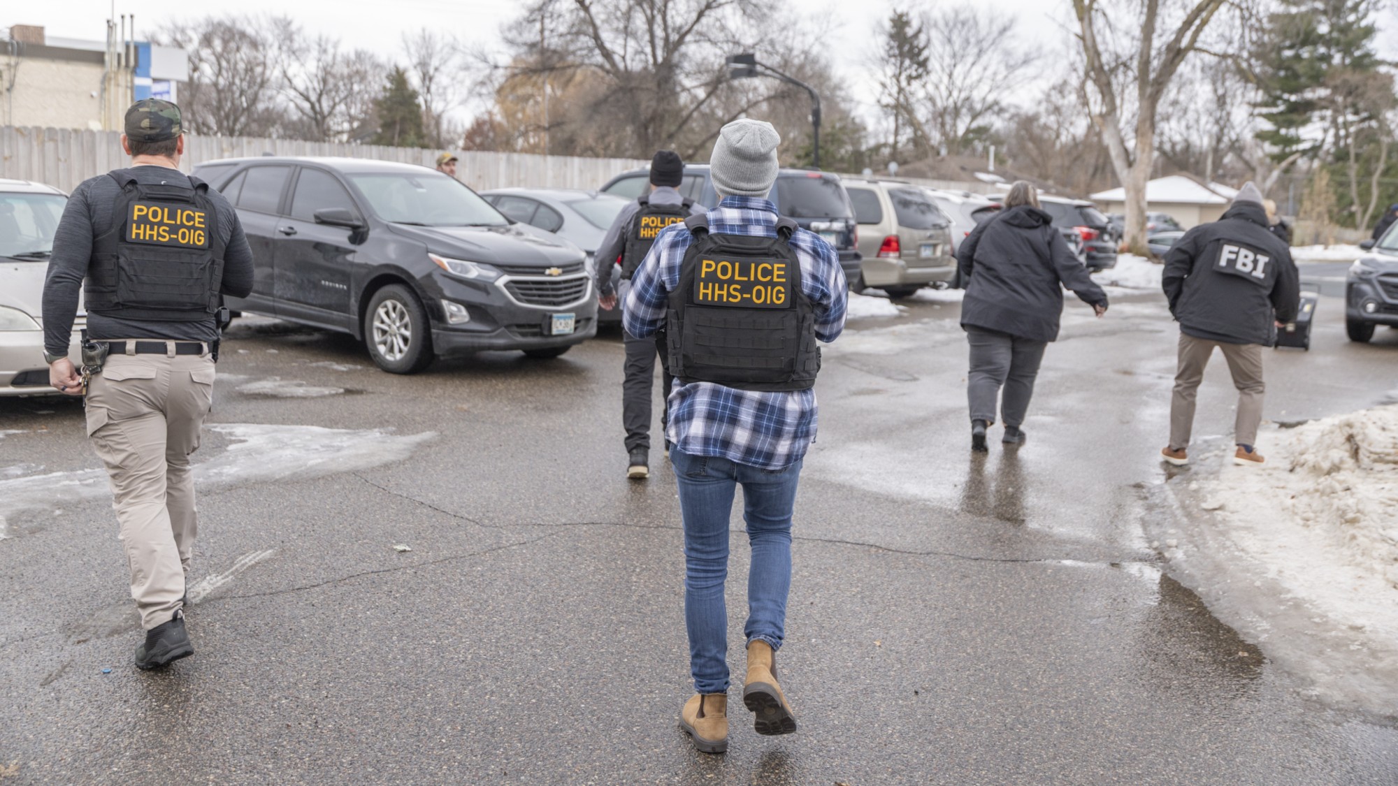 Federal agents execute a search warrant at a business as part of a fraud investigation in Bloomington, Minnesota